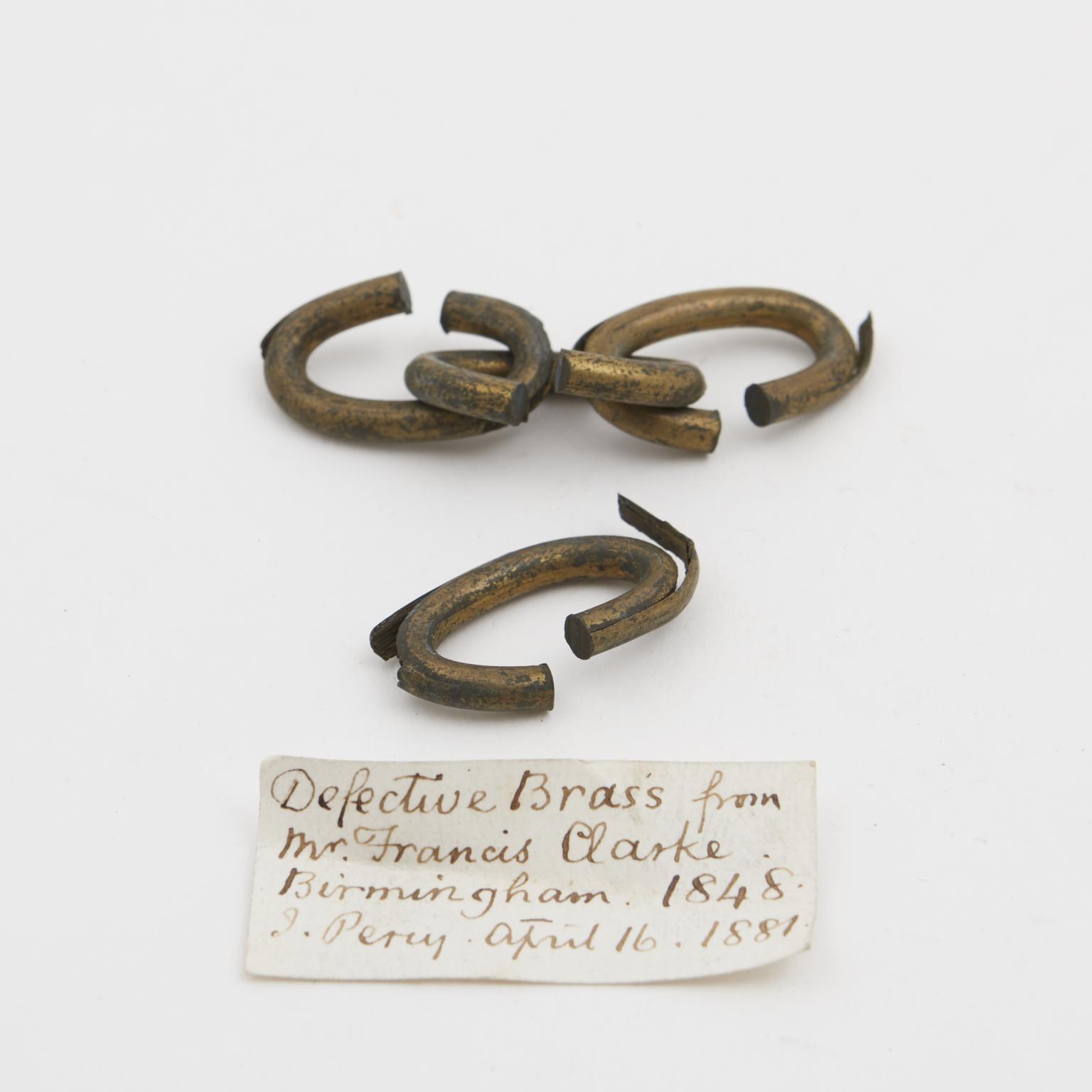 Defective brass. Splits on bending into rings (specimen)